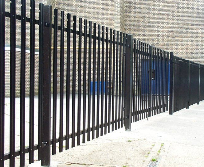 Heavy-duty palisade fencing providing secure boundary enclosure